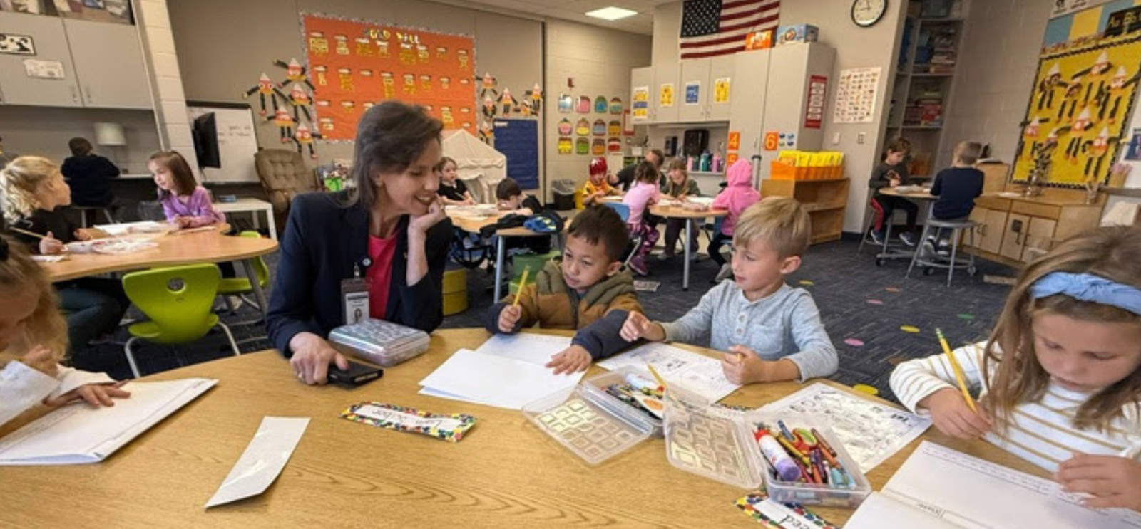 Students and staff working on a writing project