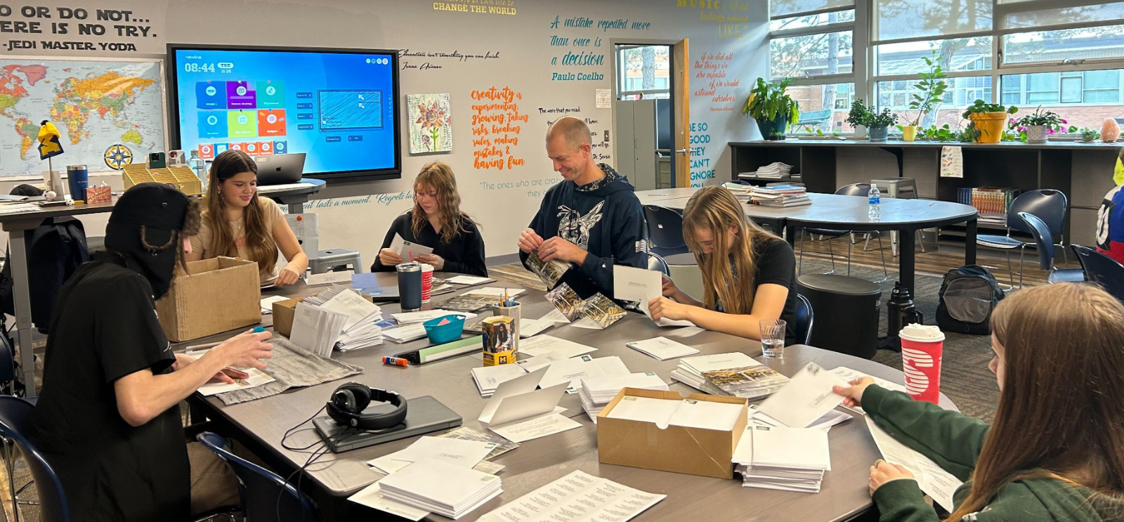 Students and teacher working on project