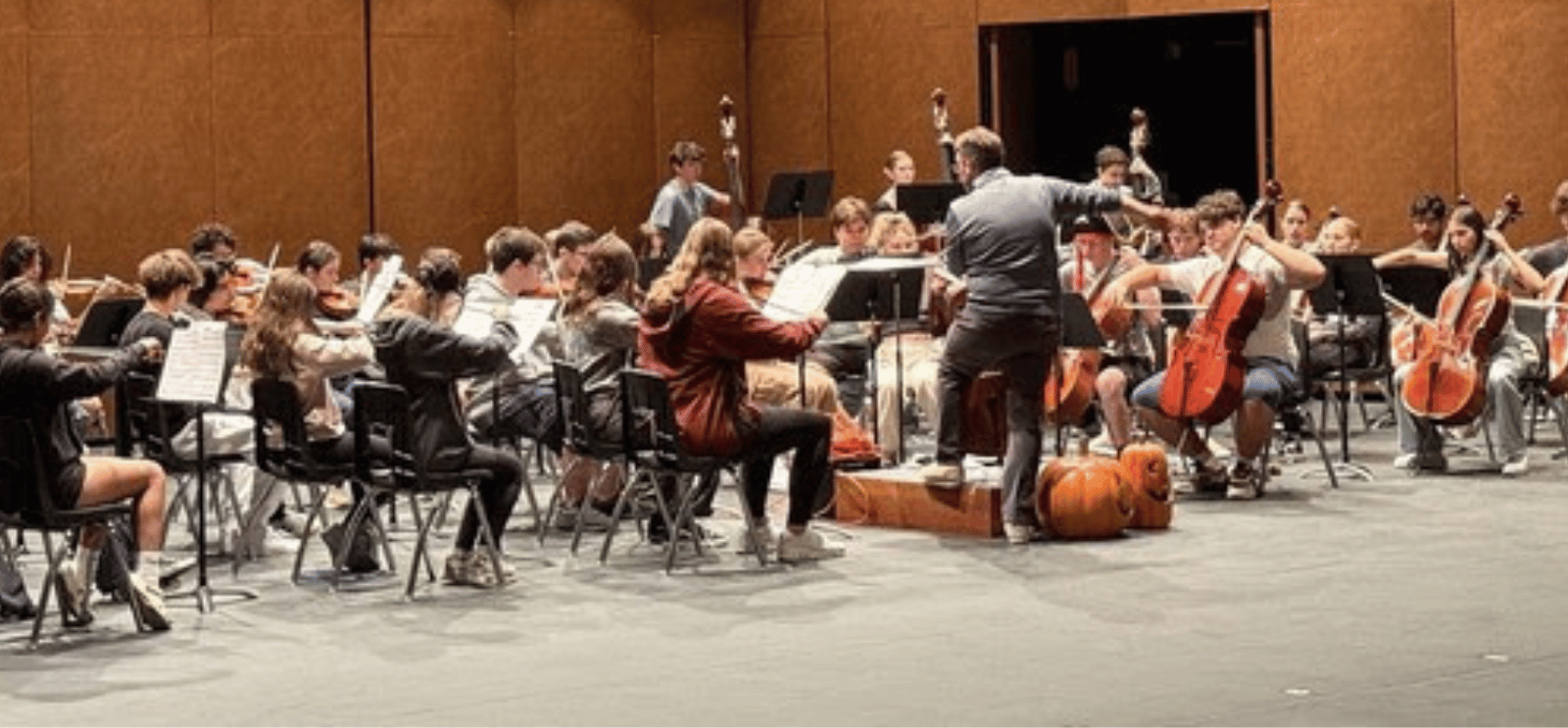High School orchestra playing on stage