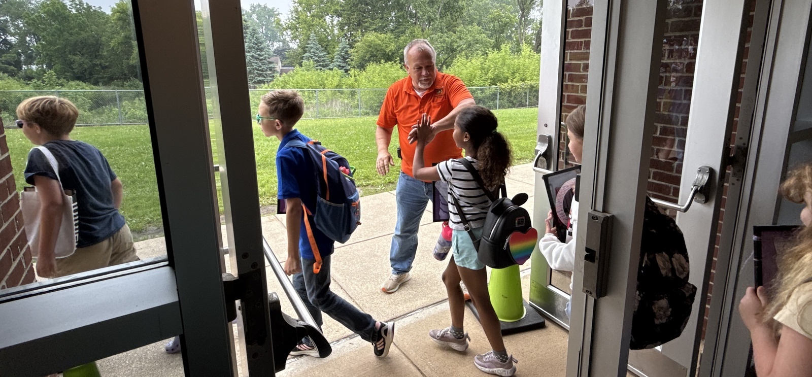 PR Students with Mr. Tracey giving high 5s