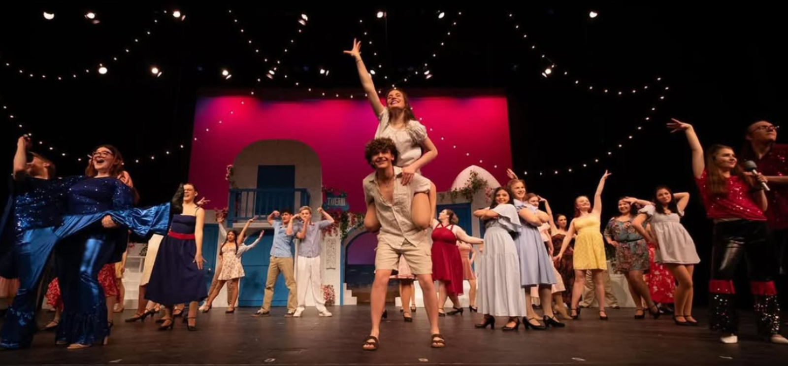 Drama students on stage during a performance
