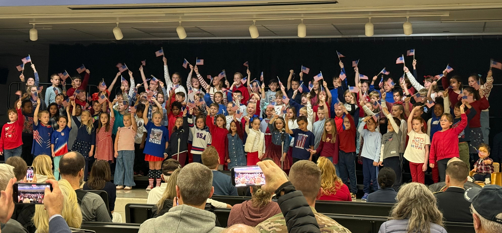 Students performing for audience for Veterans Day Celebration