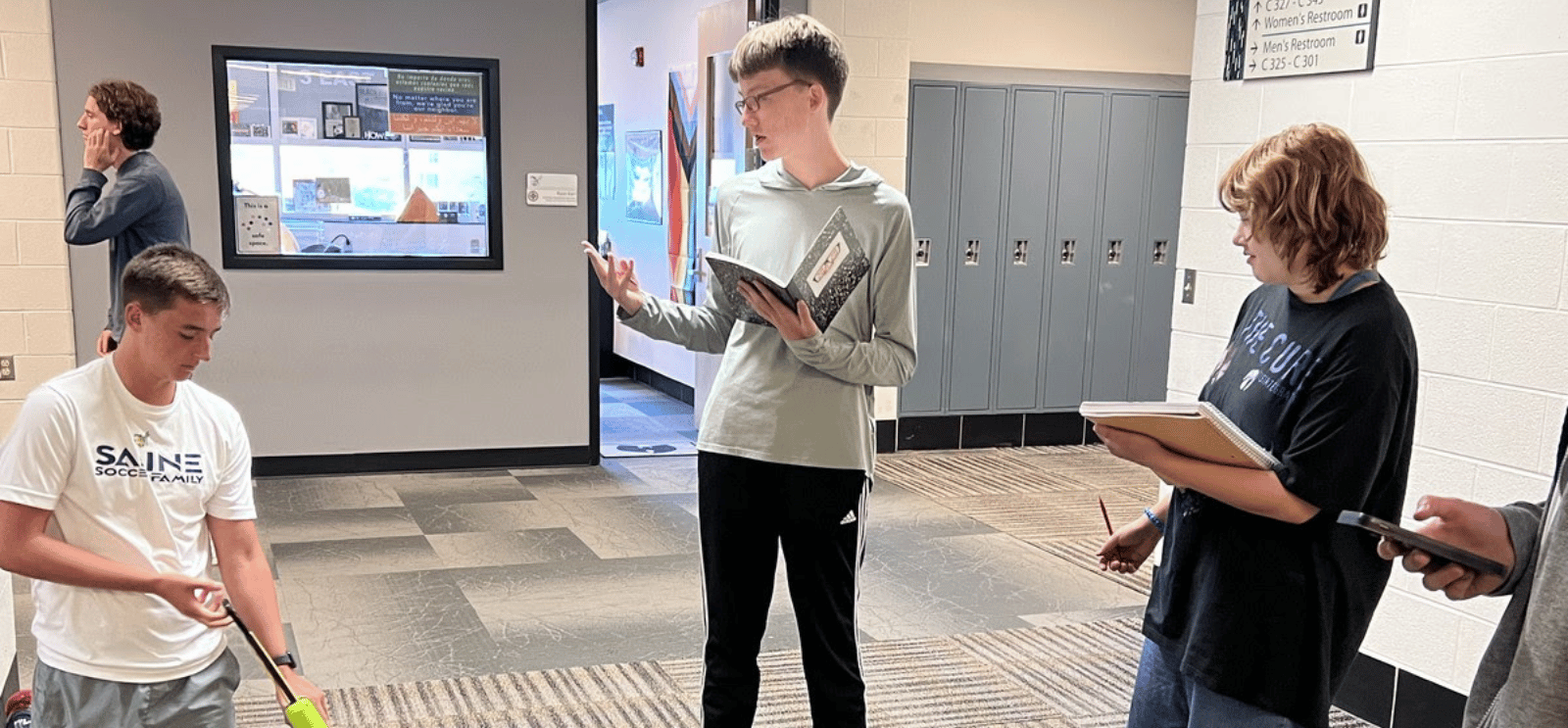 2024 Students rehearsing in a hallway